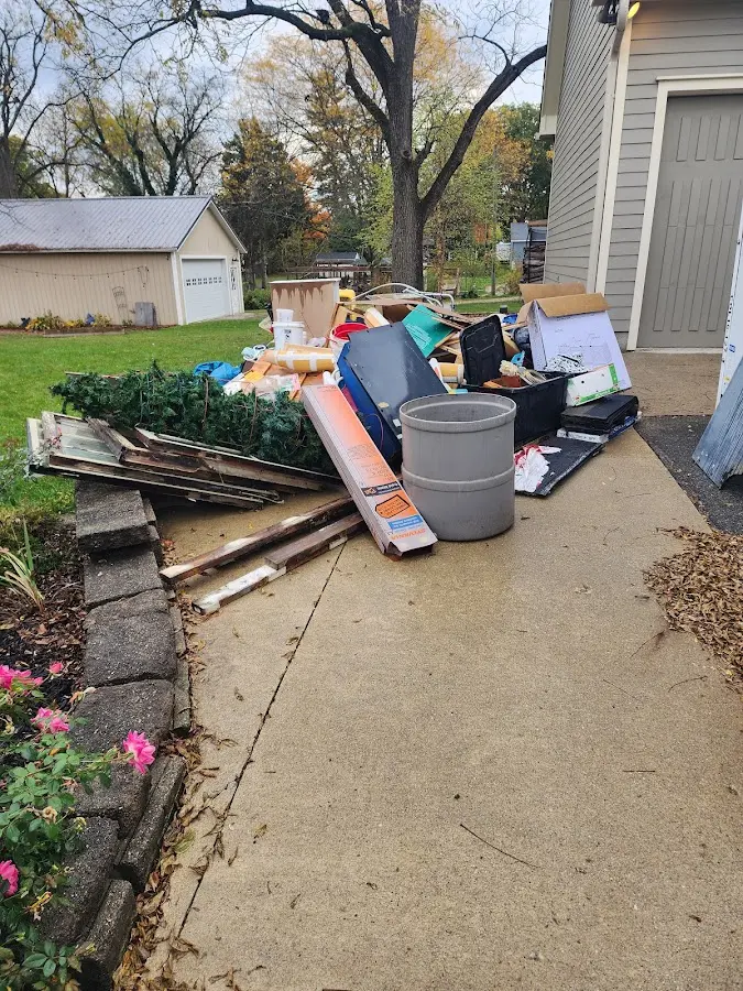 Dumpster being loaded with debris for 30 Yard Dumpster Rental in Midlothian